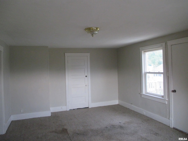 empty room featuring light carpet