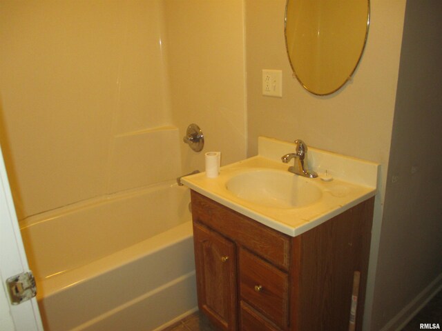 bathroom featuring shower / tub combination and vanity