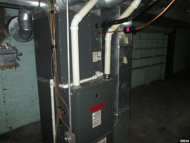 utility room with heating unit