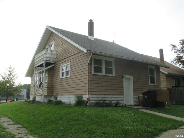 view of home's exterior featuring a lawn