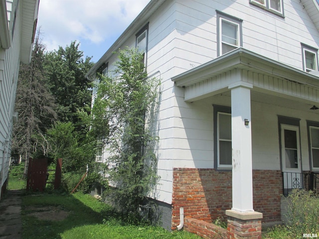 view of home's exterior with covered porch