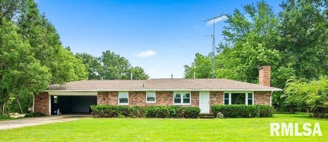 1638 Knox Highway 15, Dahinda, IL 61428 - ranch-style house featuring a front yard, a chimney, a garage, driveway, and brick siding