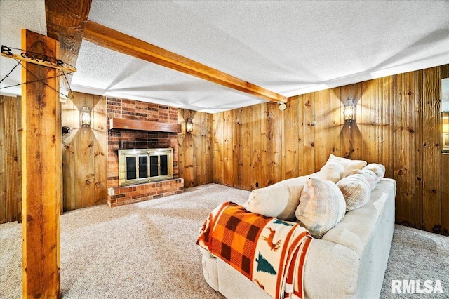 1638 Knox Highway 15, Dahinda, IL 61428 - carpeted living room featuring beamed ceiling, wooden walls, a textured ceiling, and a fireplace