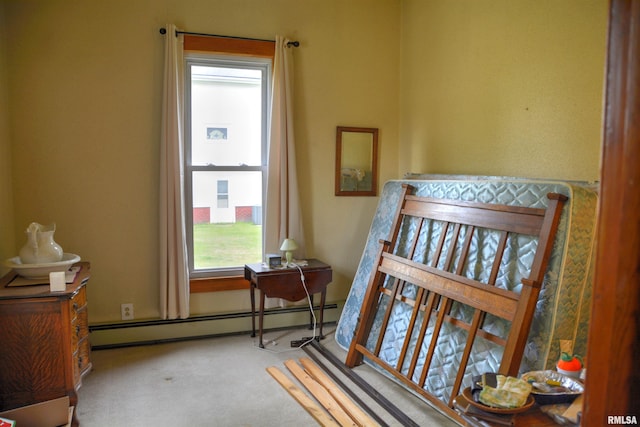 bedroom with a baseboard radiator and carpet flooring