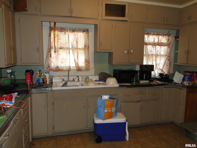324 N Charles St, Macomb, IL 61455 - kitchen featuring black microwave, light tile patterned floors, and a sink