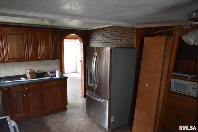 kitchen featuring carpet and stainless steel fridge with ice dispenser