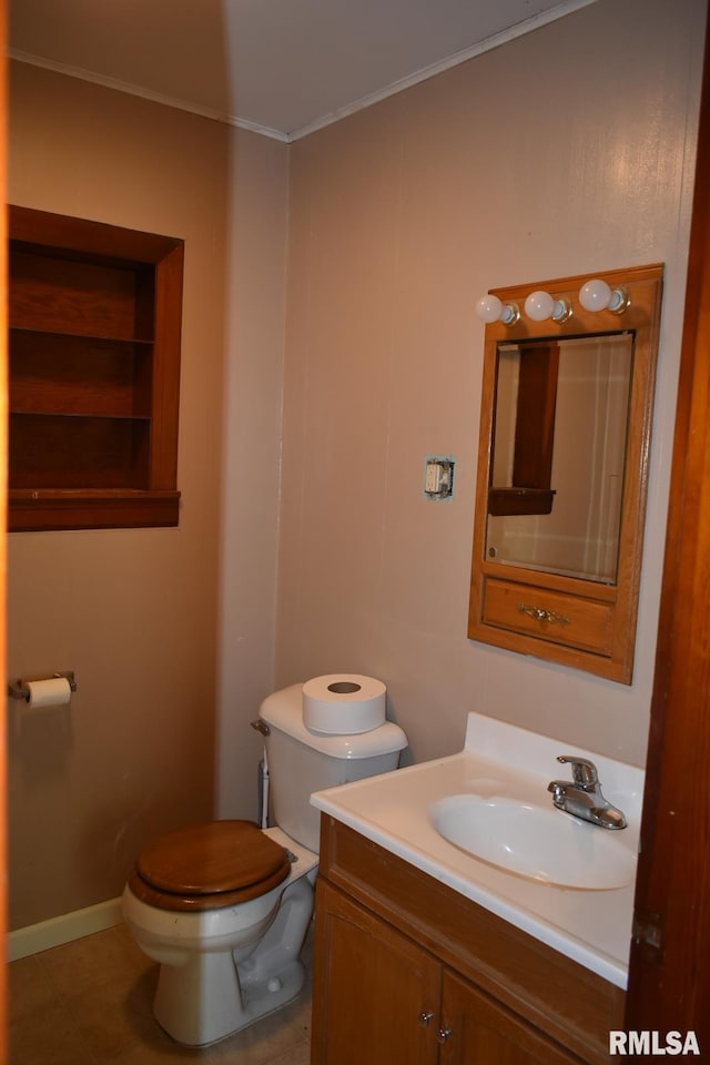 bathroom featuring tile patterned floors, toilet, and vanity