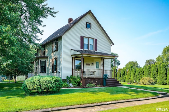 view of front facade with a porch and a front yard