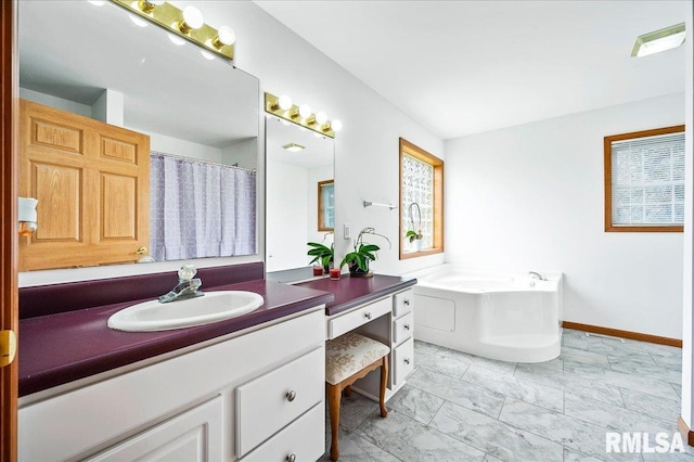 bathroom with vanity and a bathtub