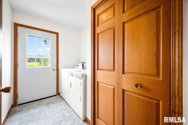 washroom featuring washer and clothes dryer