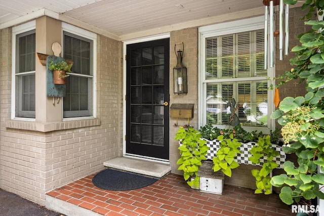 doorway to property featuring a porch