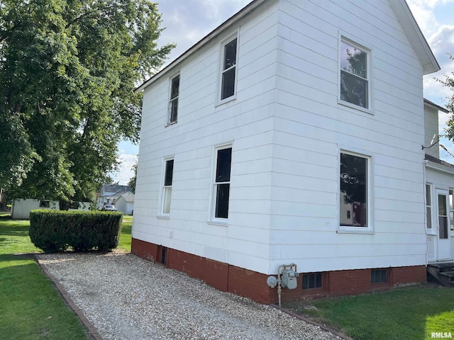 view of property exterior featuring a yard