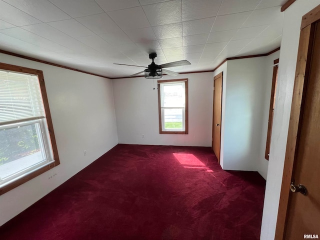 carpeted empty room featuring ceiling fan