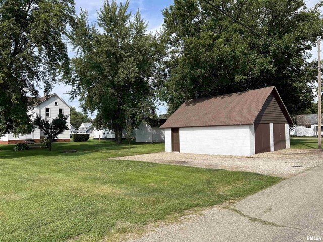 exterior space featuring an outbuilding and a garage