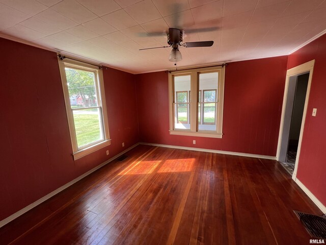 unfurnished room with ceiling fan, crown molding, and wood-type flooring