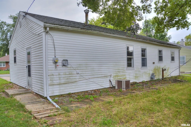 view of side of property featuring central AC unit