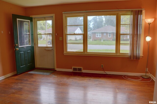 doorway to outside with hardwood / wood-style floors