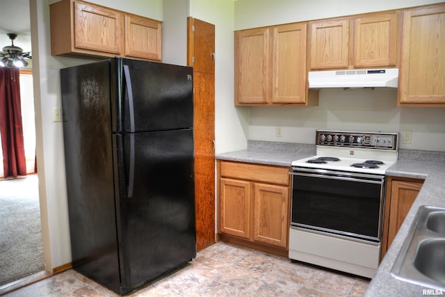 kitchen featuring light tile patterned floors, electric stove, black fridge, ceiling fan, and sink