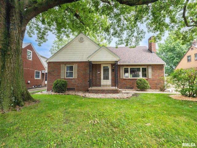 single story home with brick siding, a chimney, and a front lawn