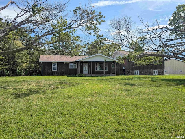 ranch-style home featuring a front yard