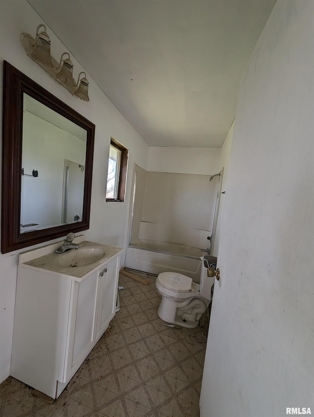 full bathroom featuring vanity, washtub / shower combination, and toilet