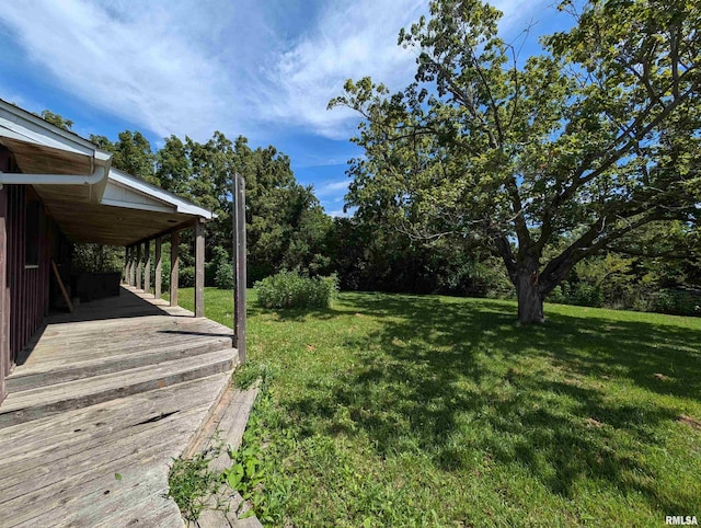 view of yard with a deck