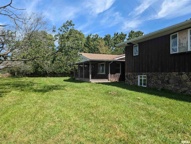 view of yard with a sunroom