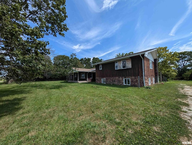 back of house with a yard