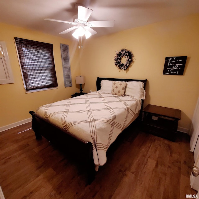 bedroom with ceiling fan and dark hardwood / wood-style flooring