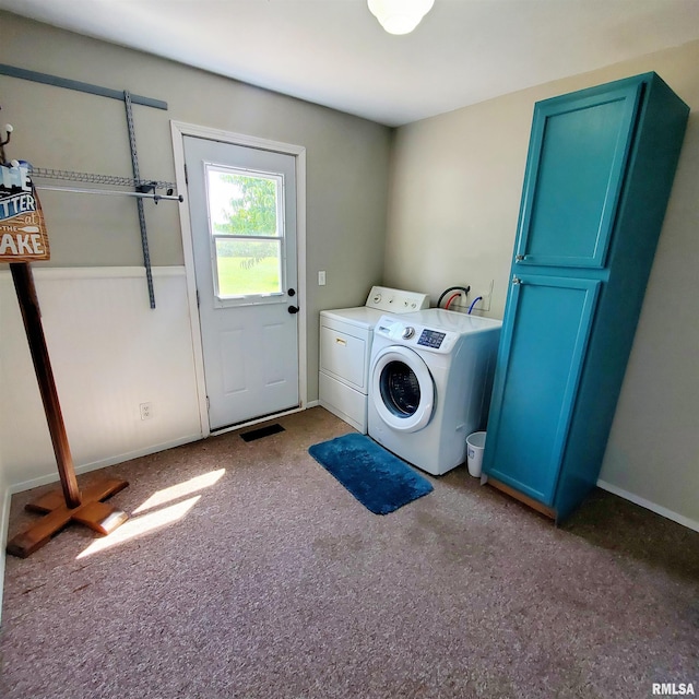 washroom featuring washer and dryer and carpet flooring