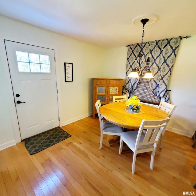 dining area with light hardwood / wood-style flooring