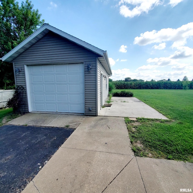 garage featuring a yard