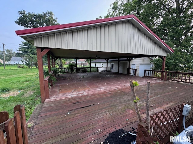 wooden deck featuring a gazebo and a lawn