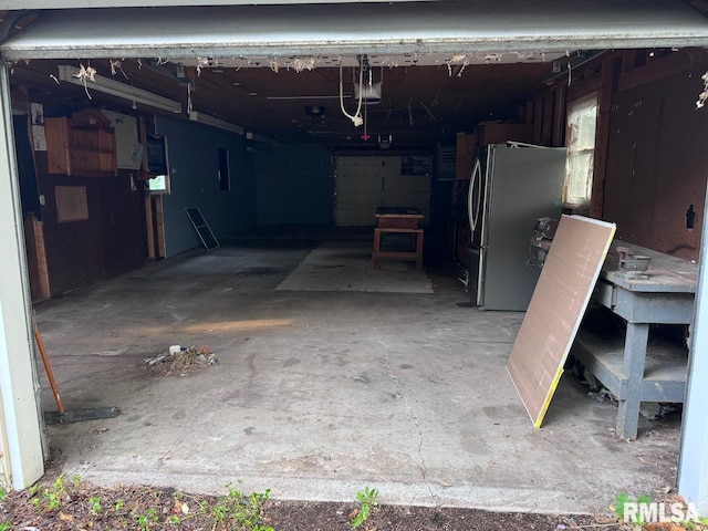 garage featuring stainless steel fridge