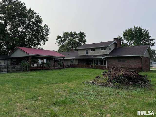 back of house featuring a yard