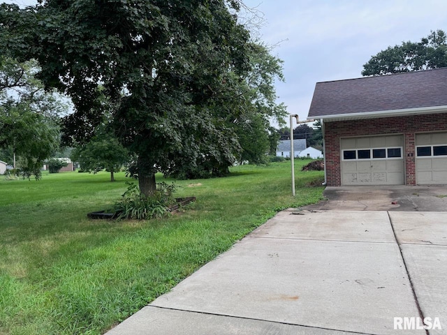 view of yard featuring a garage