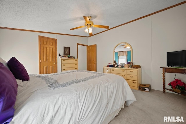 bedroom featuring a textured ceiling, ceiling fan, and light carpet