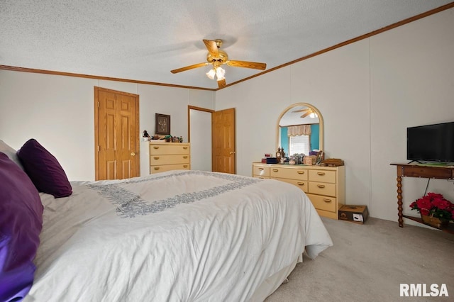 bedroom with a textured ceiling, crown molding, and light carpet