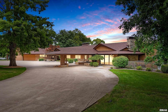 view of front of property with a yard