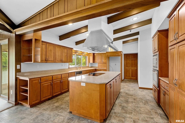 kitchen with beam ceiling, a kitchen island, stainless steel appliances, light stone counters, and island exhaust hood