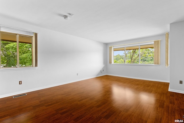 unfurnished room featuring wood-type flooring