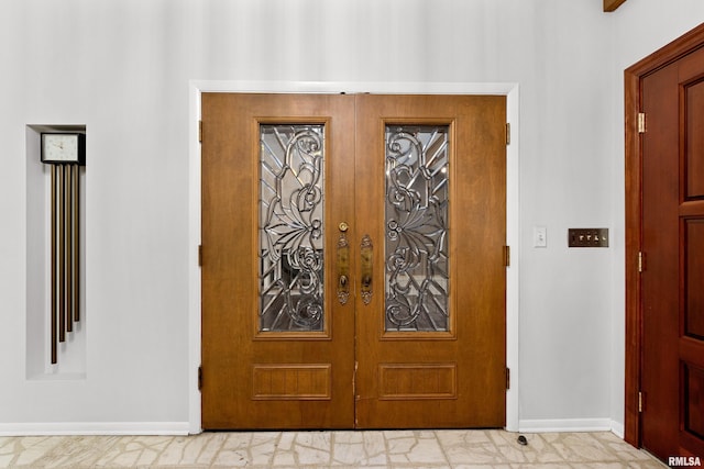 entryway featuring french doors