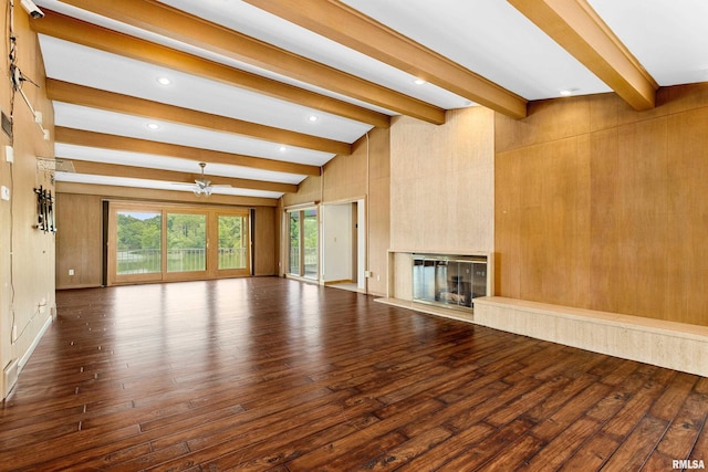 unfurnished living room with a premium fireplace, wood-type flooring, a wealth of natural light, and ceiling fan