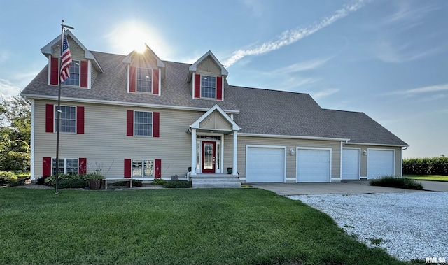 view of front of property with a garage and a front yard