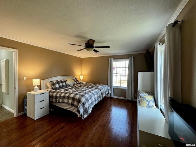 bedroom with crown molding, dark wood-type flooring, a textured ceiling, and ceiling fan