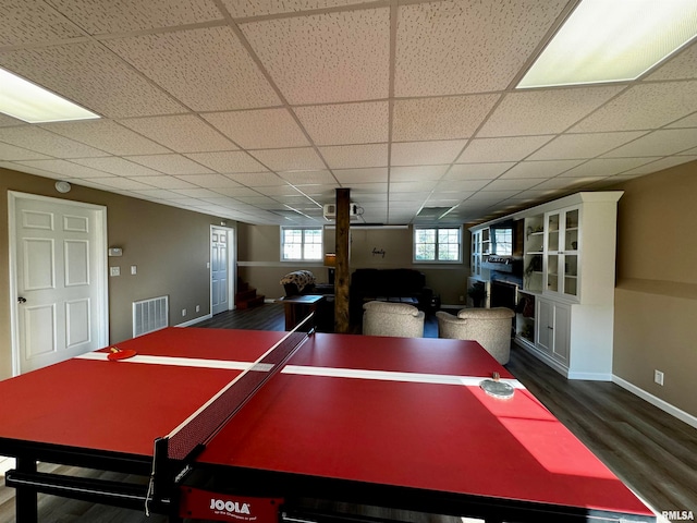 recreation room featuring hardwood / wood-style flooring and a paneled ceiling