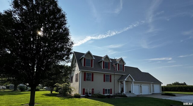 view of front of house featuring a front yard and a garage