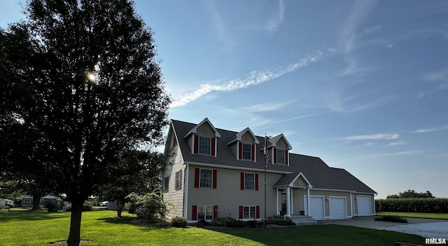 view of front of home with a garage and a front yard