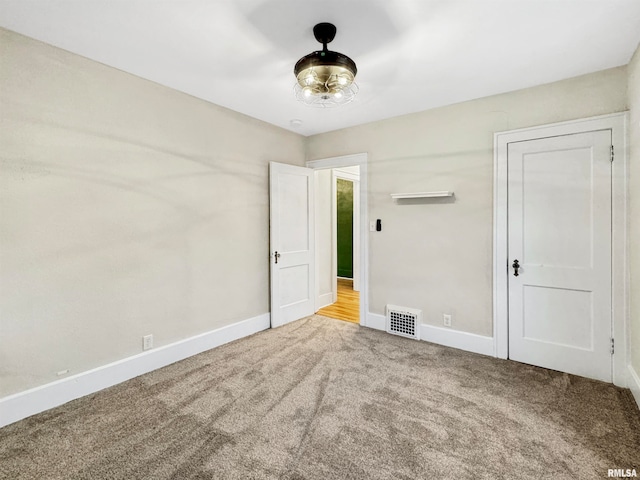 unfurnished bedroom featuring carpet flooring