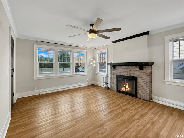 unfurnished living room featuring a brick fireplace, crown molding, light hardwood / wood-style flooring, ceiling fan, and a baseboard heating unit